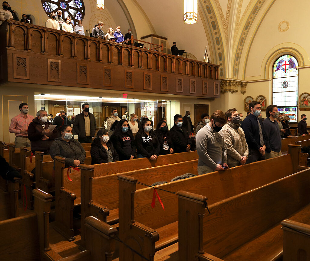 Attendees gather at Sacred Heart Catholic Church